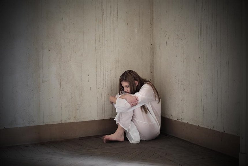 bigstock Lonely mad woman sitting in th 32607254